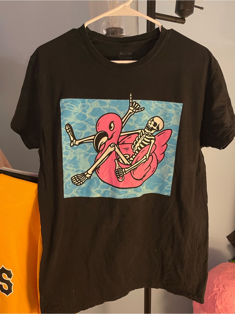 Men’s Black Graphic Tee with Pink Flamingo Float and Skeleton